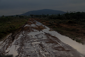 Muddy road in the darkness of the early morning
