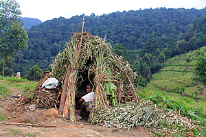 A woman inside her hut