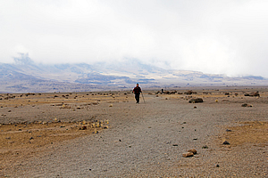 Me walking across the barren desert 