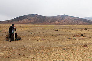 Hiker resting on the desert 