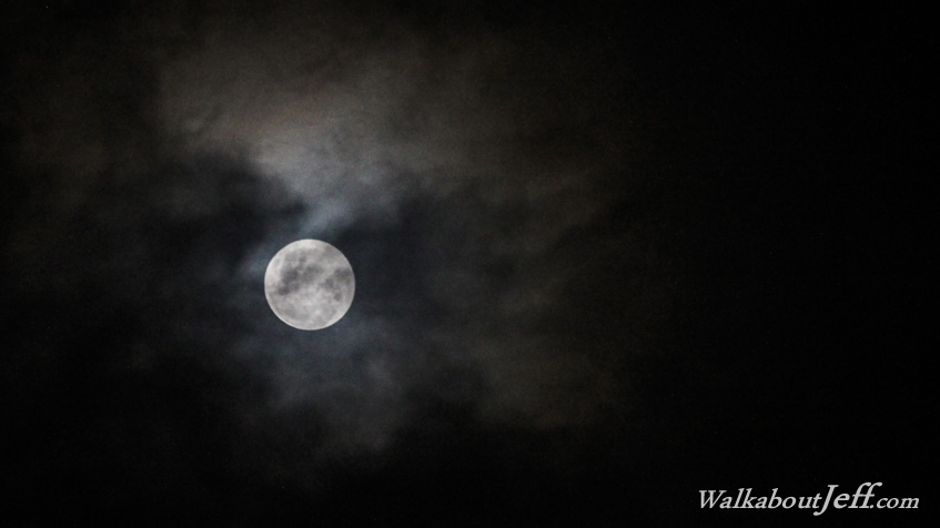 Full moon behind the clouds