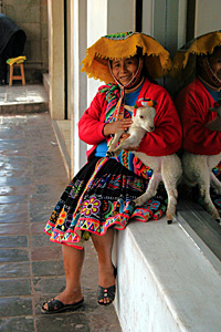 Woman with a baby alpaca