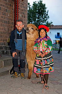 Posing with a local and an alpaca